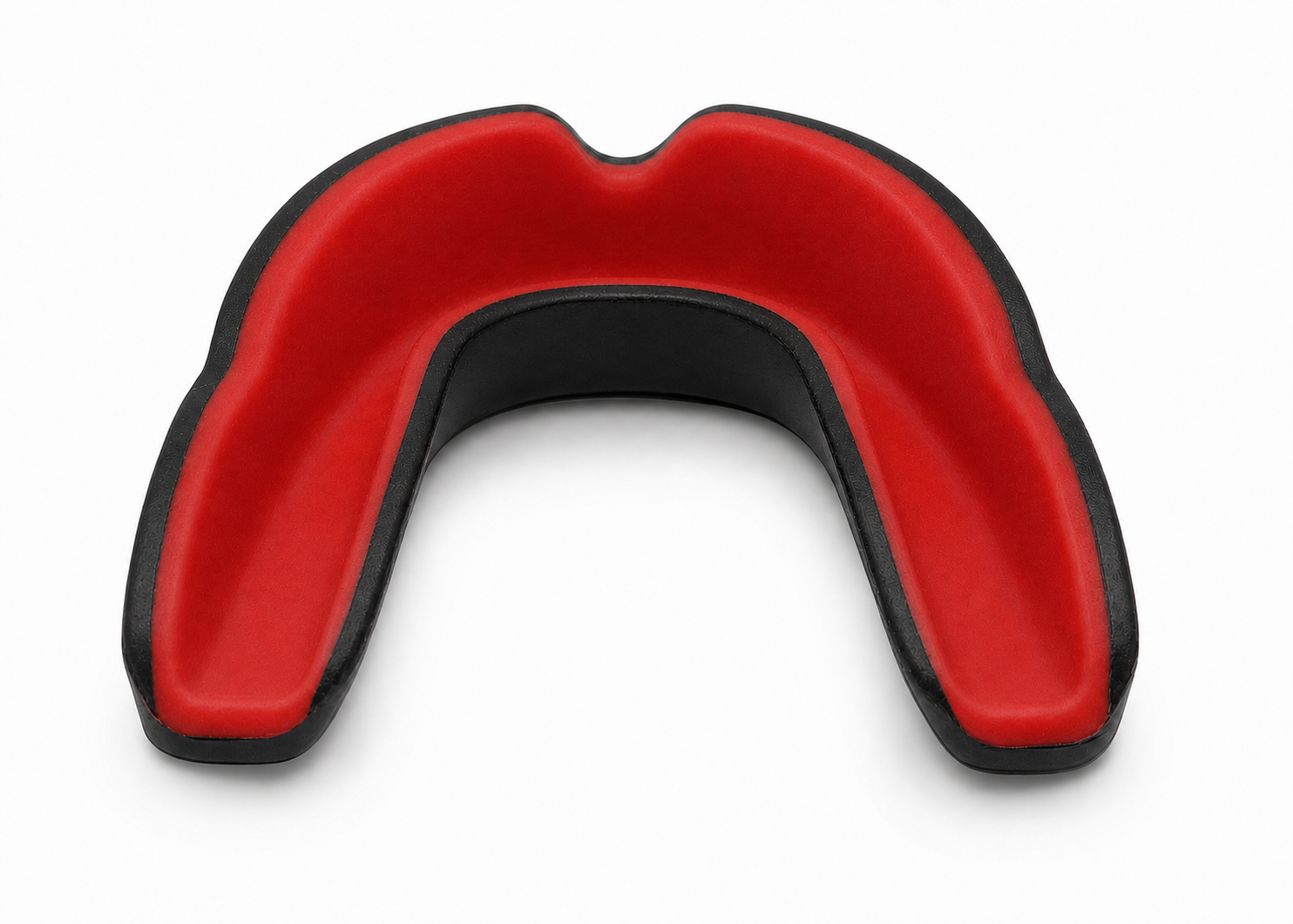 Top view of the Obsidian NewHour mouthguard showing the full matte red chew channel and black rim